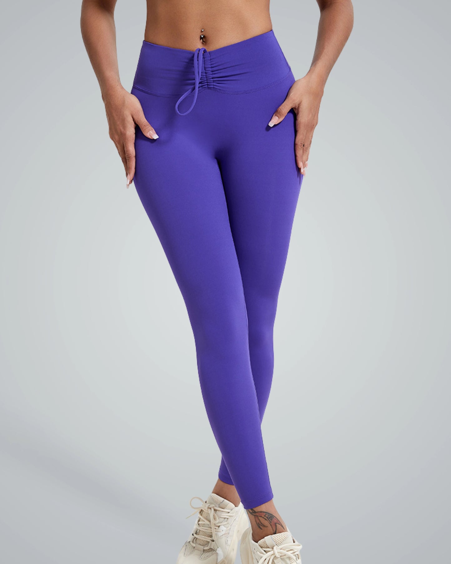 Woman wearing Bandsam Coral Crush high-rise leggings showcasing flexible, comfortable activewear perfect for workout, yoga, or lounging.