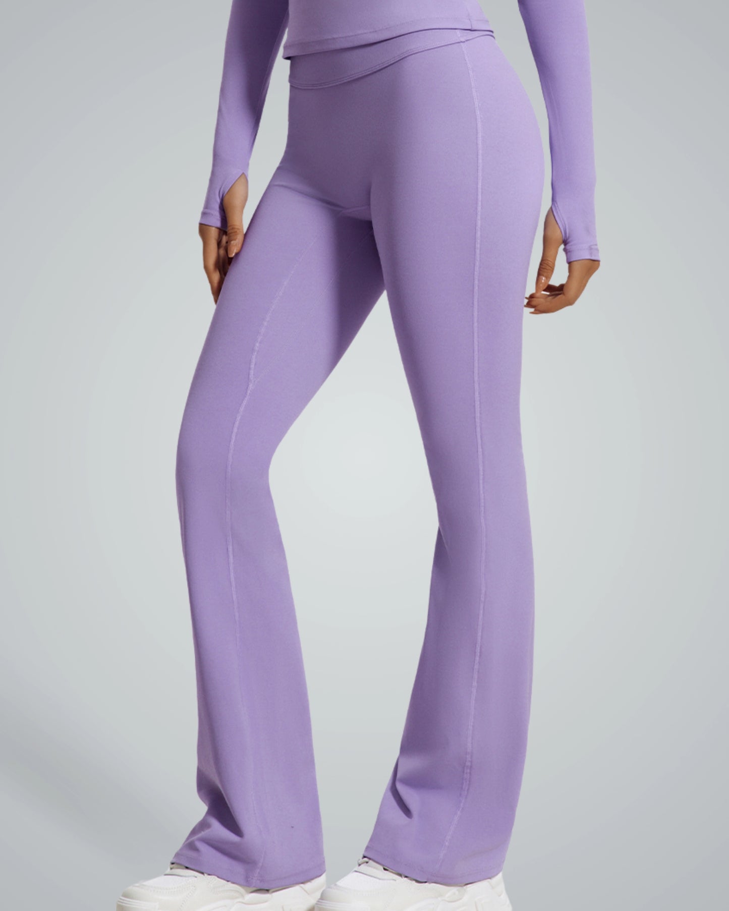Woman wearing Bandsam CurvAlign Pants in purple, showcasing high-waisted, stretchy activewear ideal for yoga, lounging, and workouts.