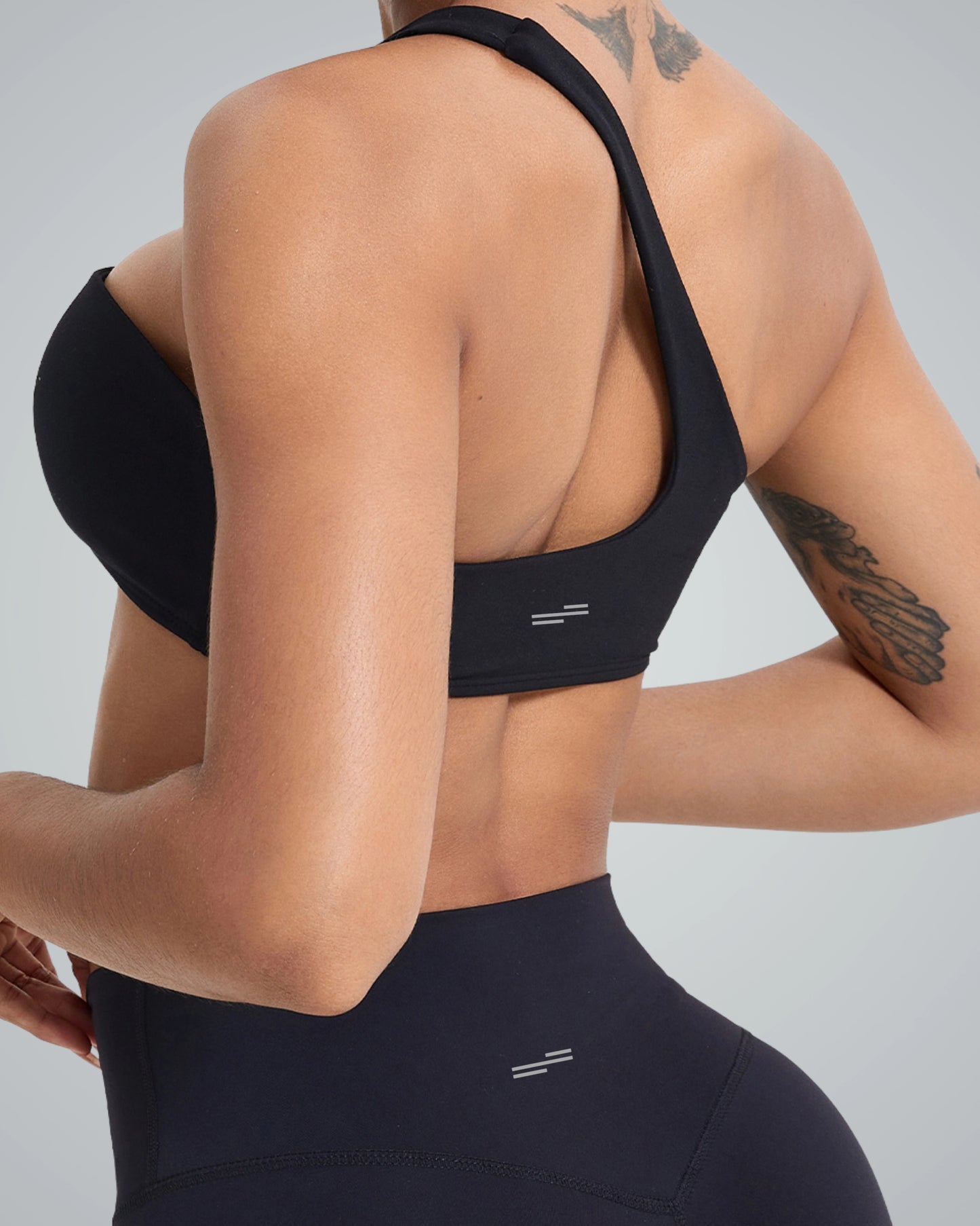 Woman wearing Bandsam Zenith Solo Bra, ideal for yoga and workout. Soft, stretch activewear offering comfort and support.