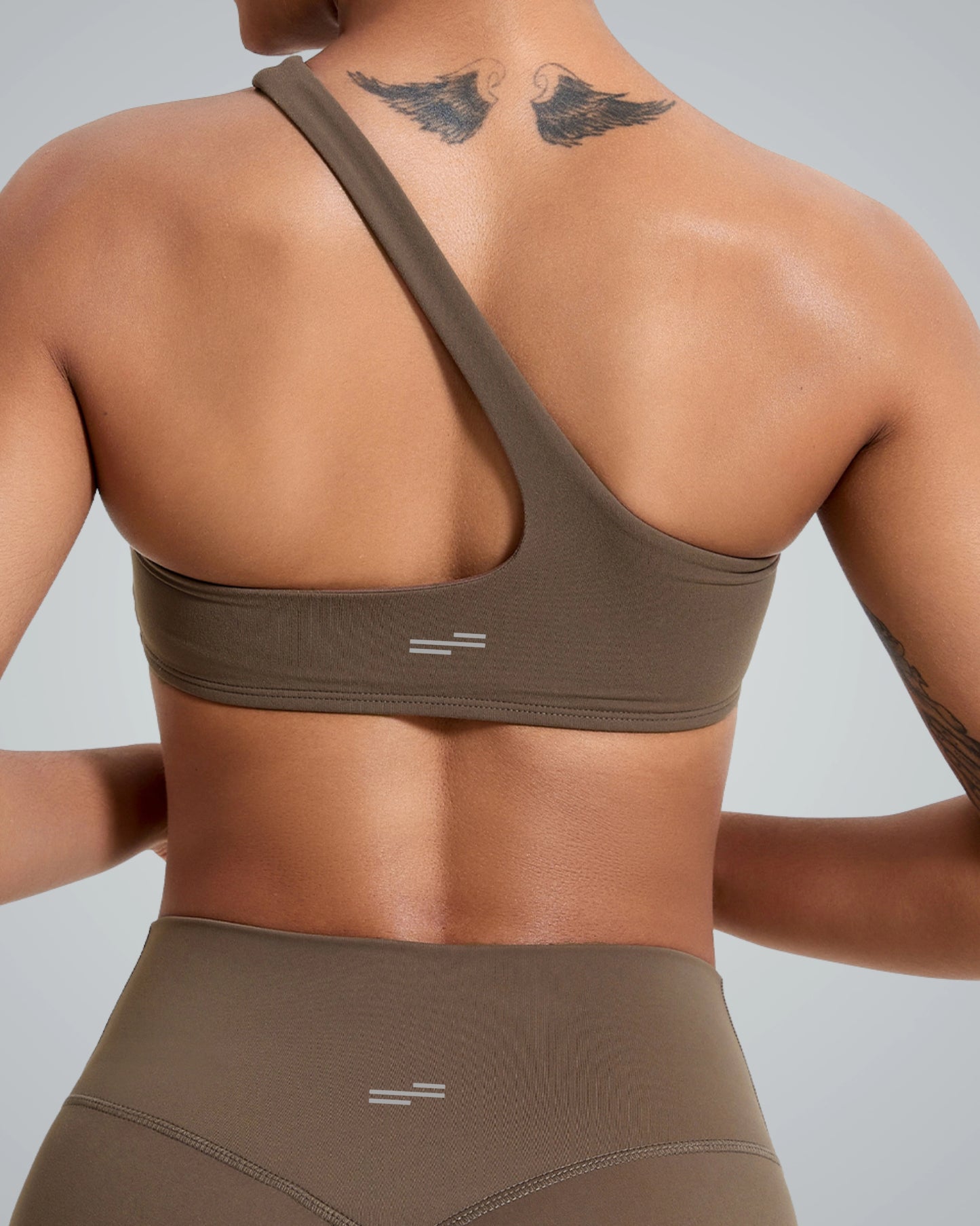 Back view of a woman wearing Bandsam Zenith Solo Bra, showcasing stretch soft fabric for activewear, perfect for yoga and workout sessions.