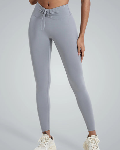 Woman wearing Bandsam Coral Crush Leggings, high-rise with scrunch-back. Soft, flexible activewear ideal for yoga, workouts, and lounging.