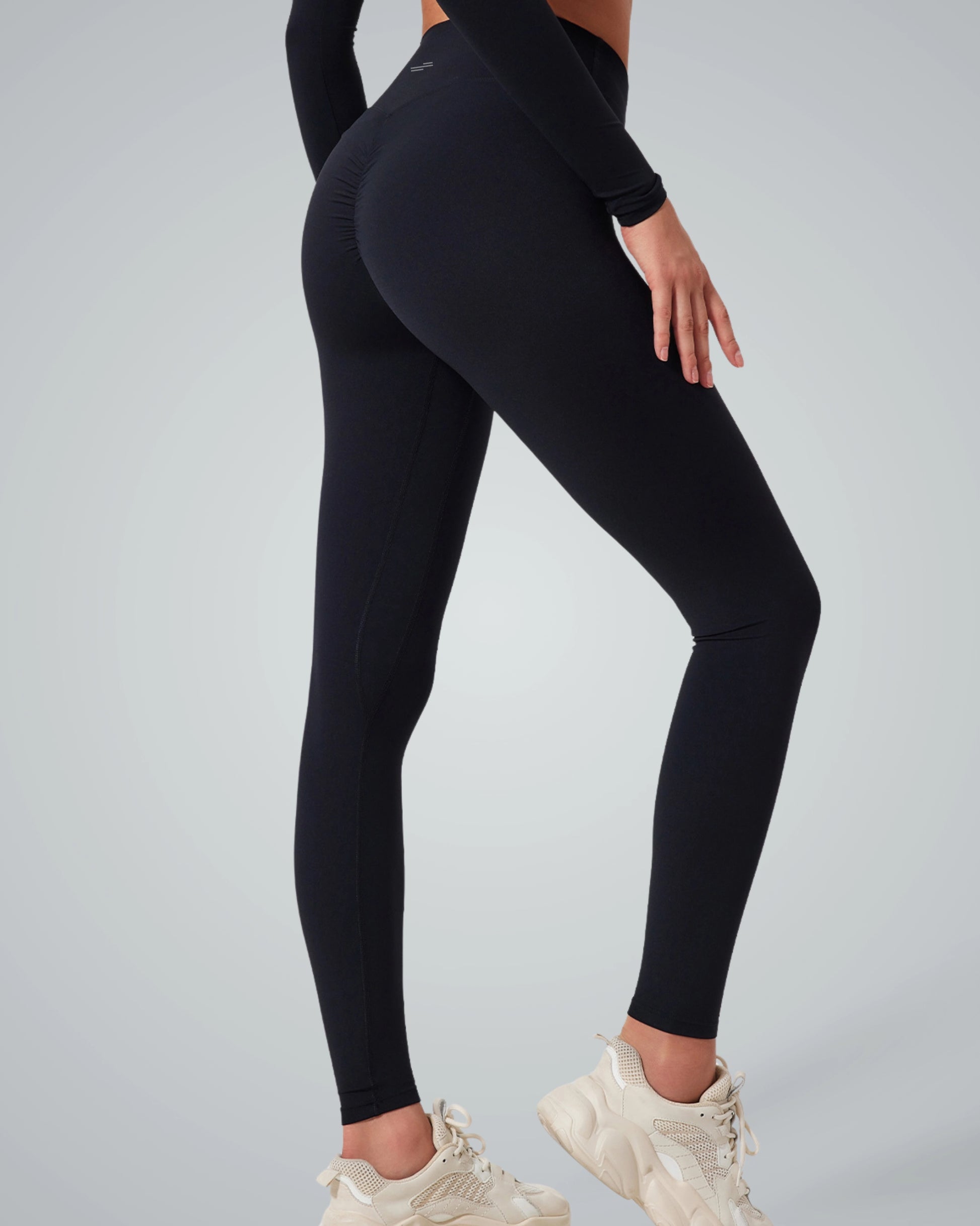 Woman wearing Bandsam AllureFit Leggings, showcasing stretch and flexibility perfect for yoga, pilates, activewear, and lounging.