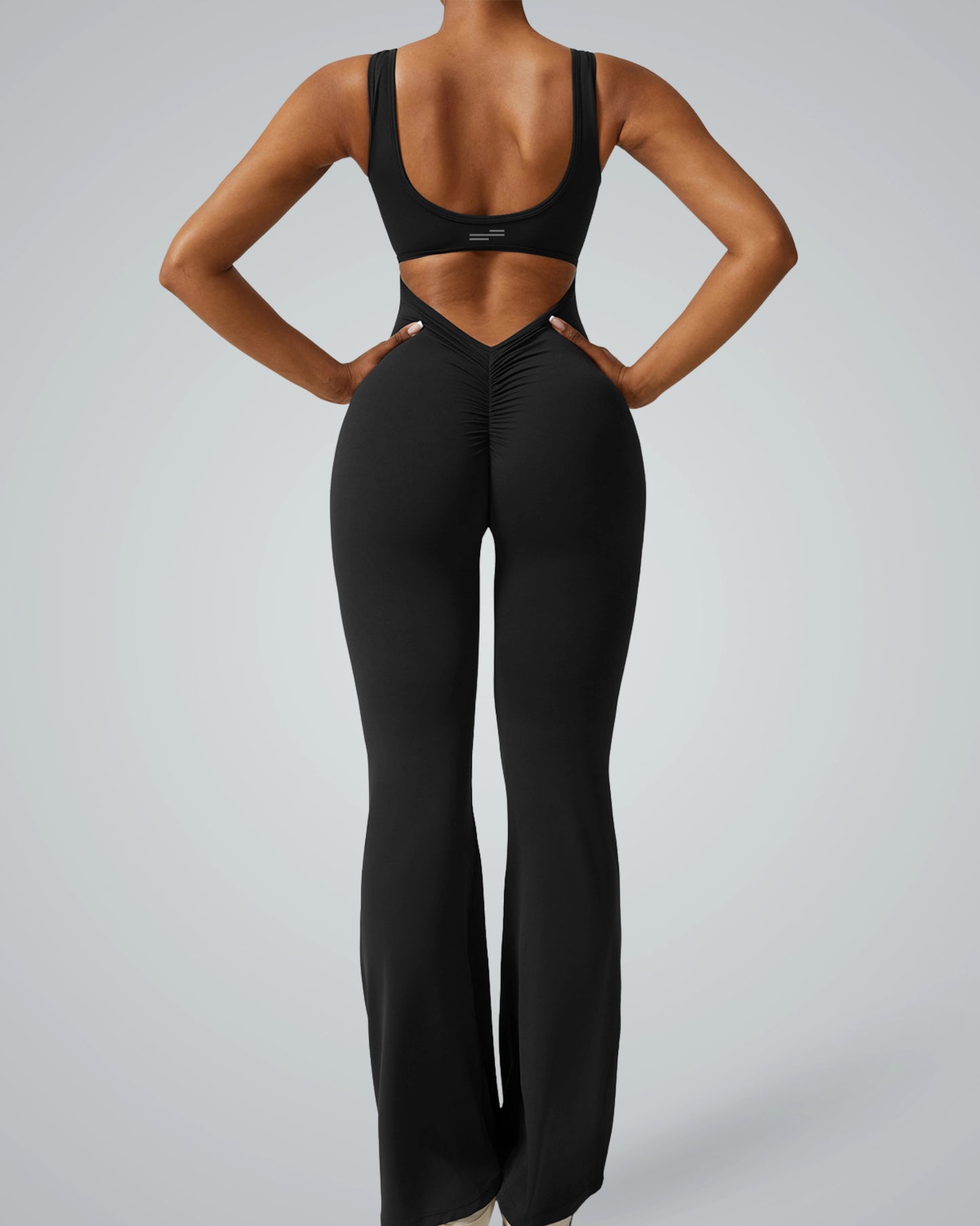 AuraFlow Jumpsuit by Bandsam featuring a sleek, fitted design with flared legs for yoga, lounging, or outdoor activities in comfort and style.