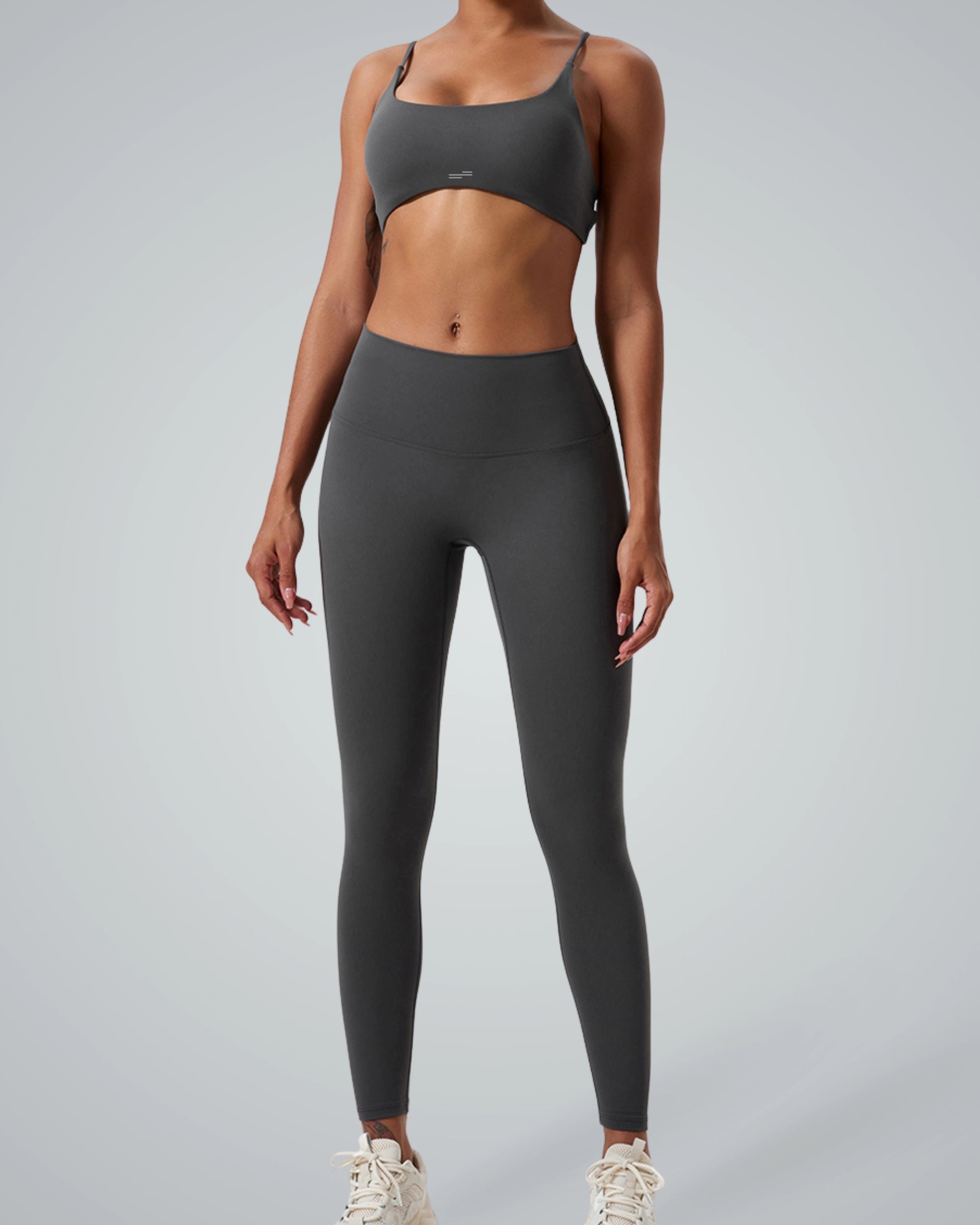 Woman wearing Bandsam ContourCore Set; matching workout set with high-waisted leggings and sports bra, ideal for seamless gym style.