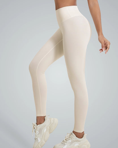 Woman wearing Bandsam CoreFit Leggings, beige high-rise stretch activewear, showcasing comfort, support, for yoga, pilates, workouts.