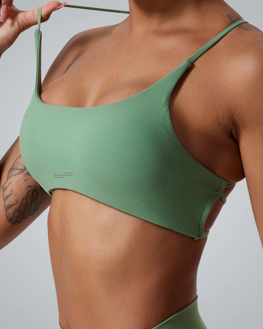 Green Bandsam Cross Flow Bra with soft stretch fabric, ideal for women's workout, yoga, and activewear. Breathable moisture-wicking design.