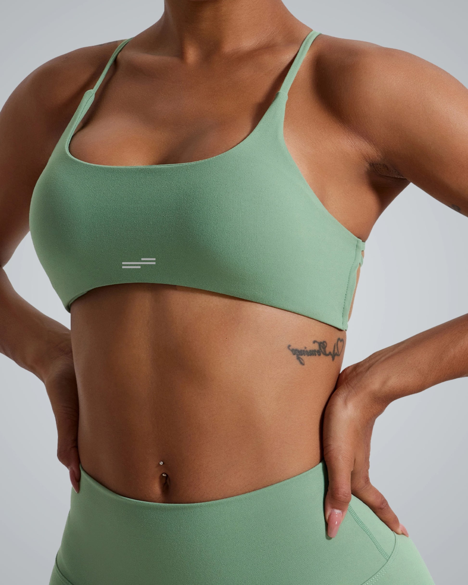 Women wearing Bandsam Cross Flow Bra in mint green, showcasing stretch, soft activewear perfect for yoga and workout sessions.