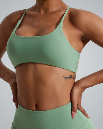 Women wearing Bandsam Cross Flow Bra in mint green, showcasing stretch, soft activewear perfect for yoga and workout sessions.