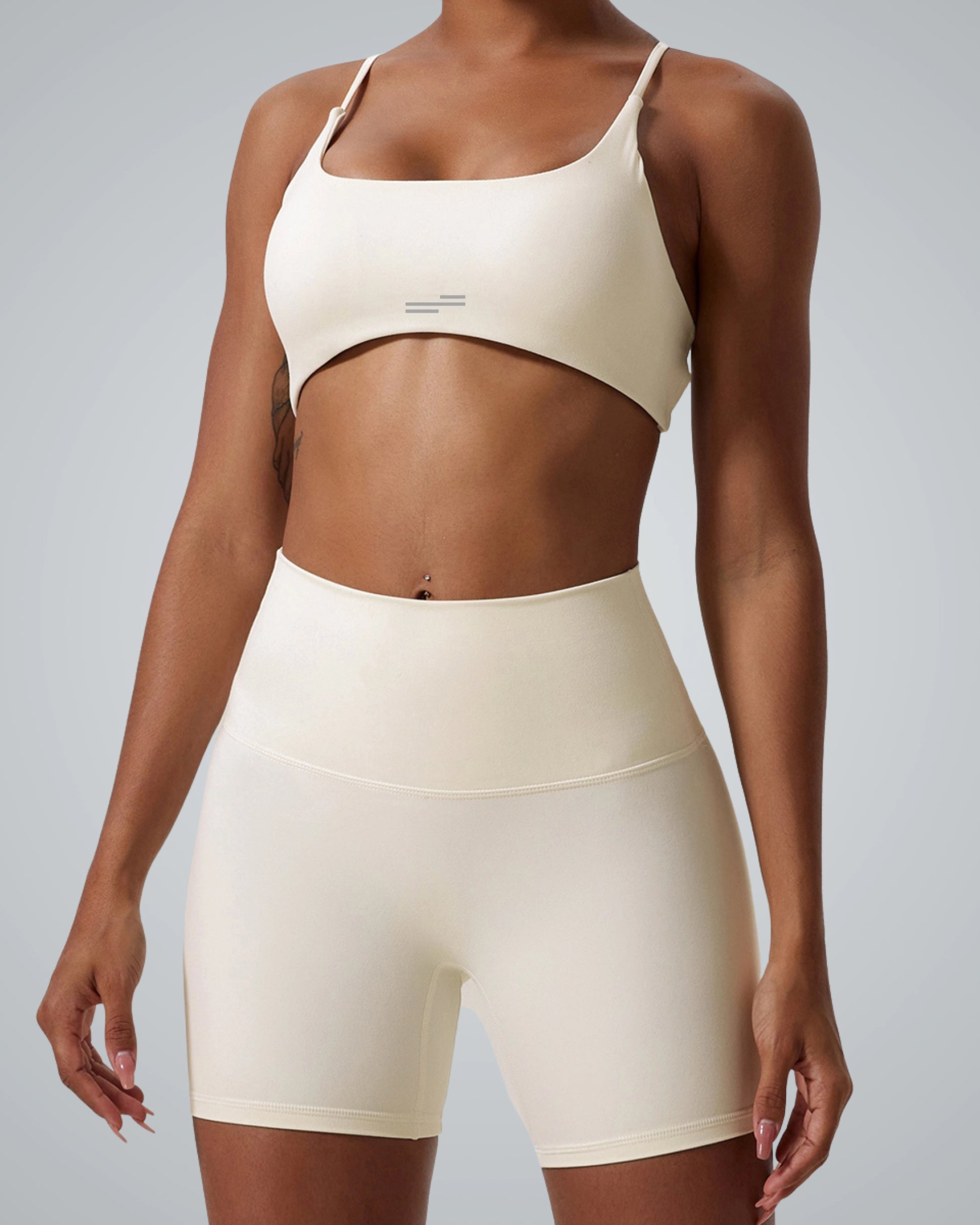 Woman wearing Bandsam Cross Flow Bra, showcasing stretch, soft fabric. Perfect for yoga, workout, and activewear. Moisture-wicking.