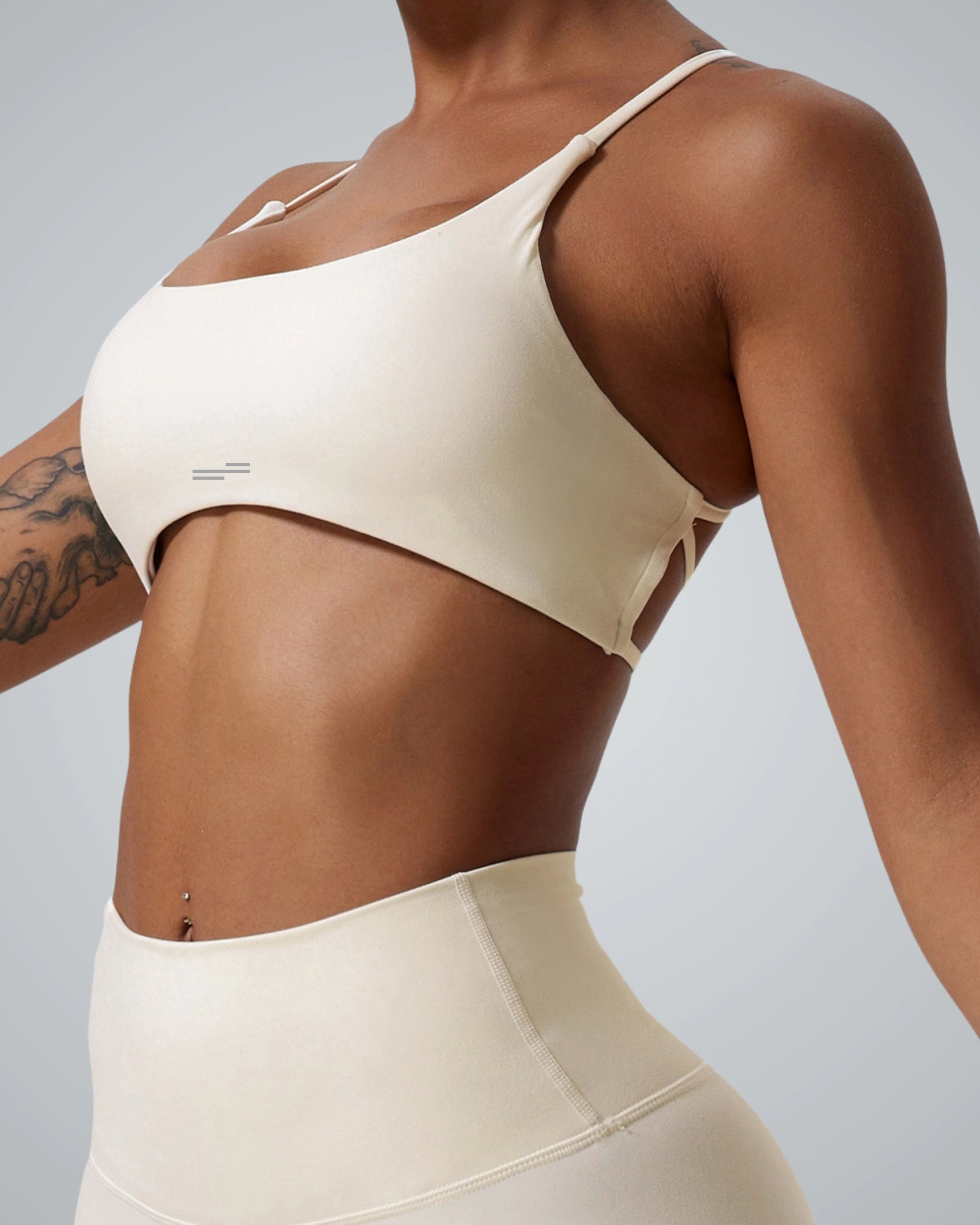Bandsam Cross Flow Bra for women in soft, stretchy activewear, ideal for yoga, workouts, and running, highlighting breathable comfort.