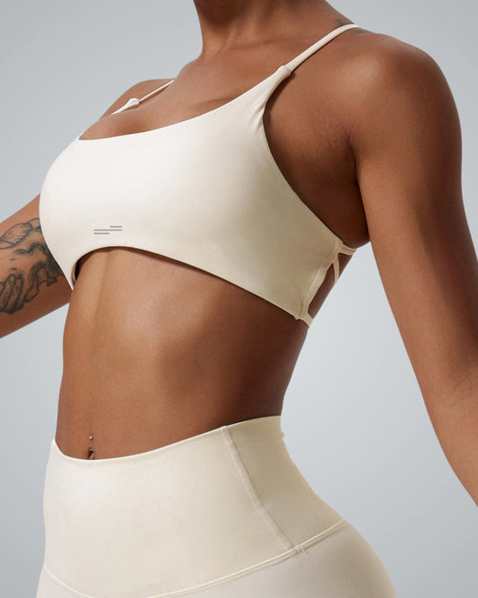 Bandsam Cross Flow Bra for women in soft, stretchy activewear, ideal for yoga, workouts, and running, highlighting breathable comfort.