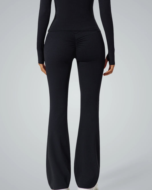 Back view of a woman wearing black Bandsam CurvAlign Pants with ruched detail, illustrating comfort and flexible activewear for women.