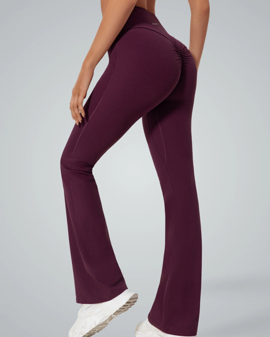 Woman wearing Bandsam CurvAlign Pants, high-waisted with ruched detailing, ideal for yoga, workout, and lounging.