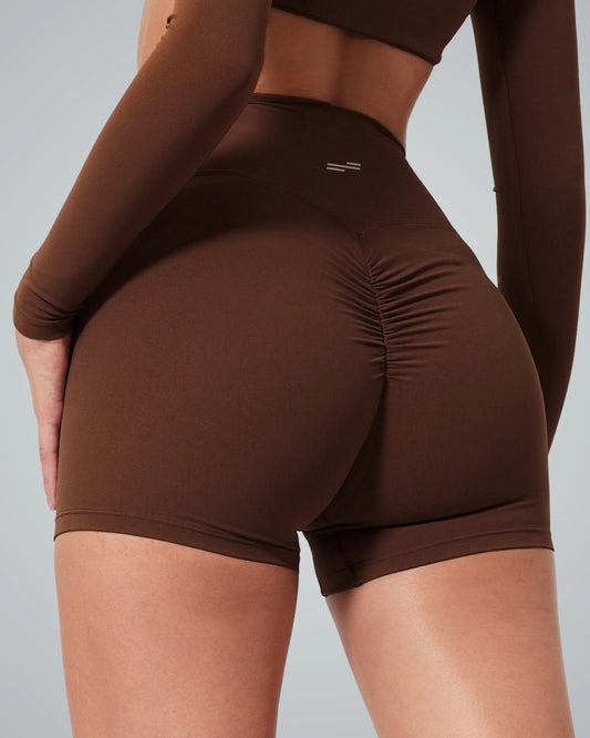 Bandsam CurveEnhance Shorts on woman; stretchy, soft activewear ideal for yoga, pilates, and lounging. Offers comfort and support for workouts.