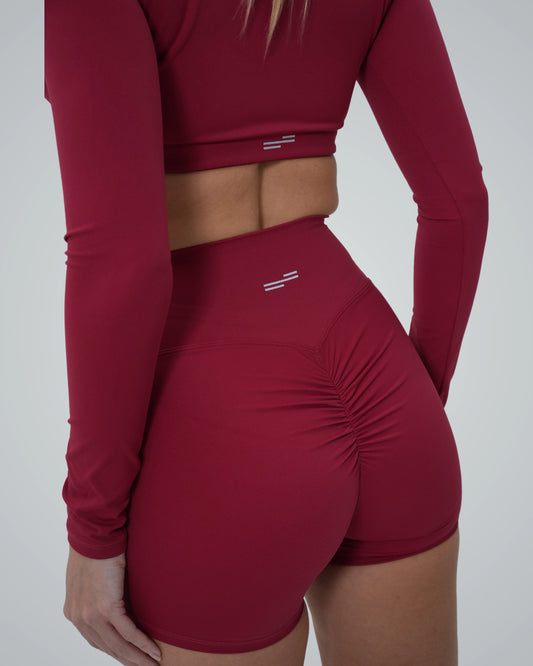 Bandsam CurveEnhance Shorts in red, designed for women's stretch, comfort, and support, perfect for yoga, workout, and relaxation.