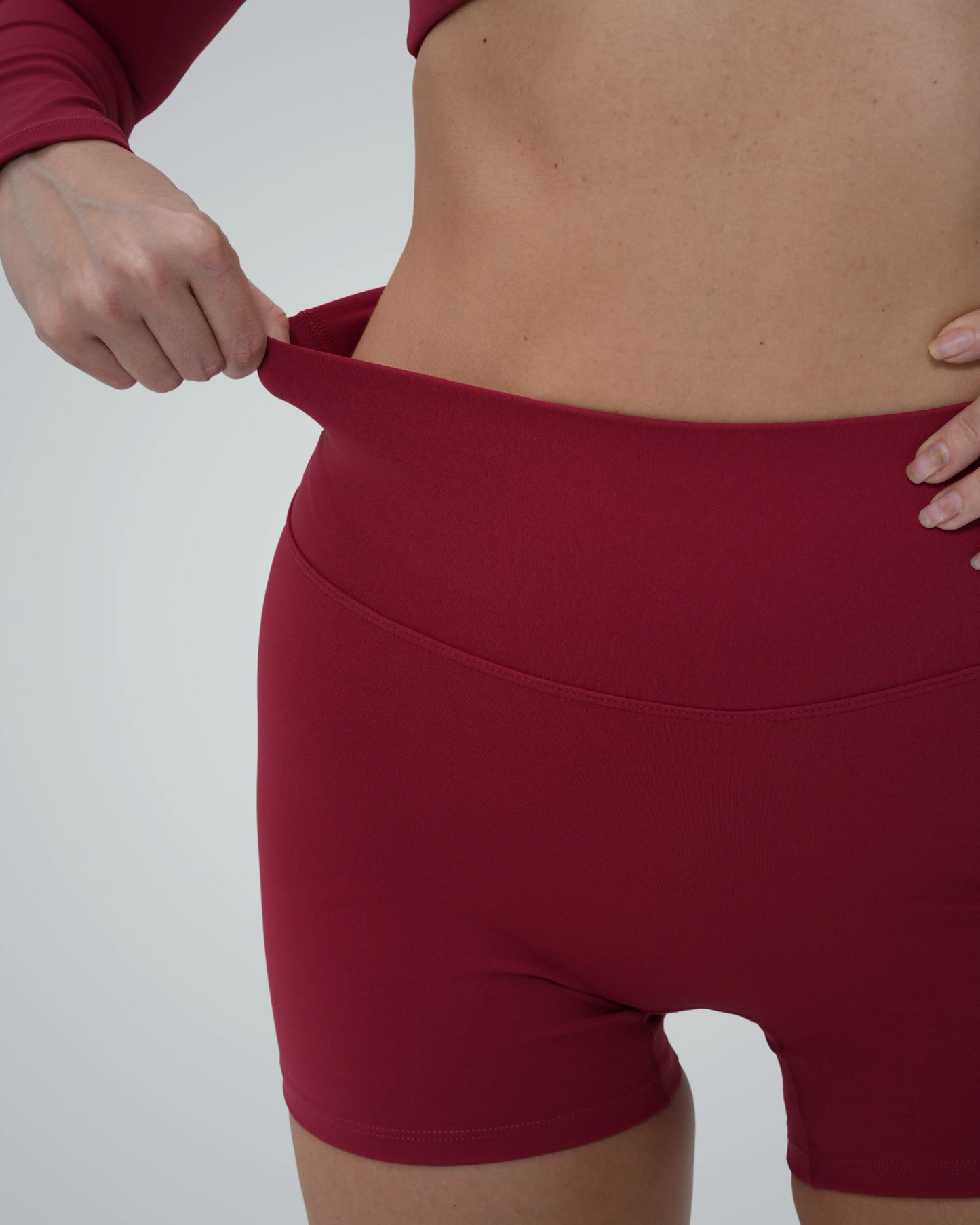 Woman wearing Bandsam CurveEnhance Shorts, highlighting stretch and comfort for yoga, Pilates, or lounging.