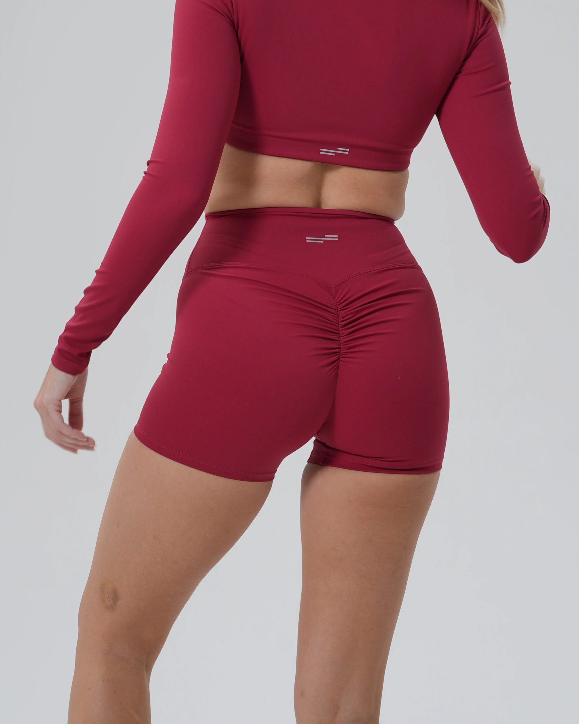 Bandsam CurveEnhance Shorts for women in red, showcasing stretch comfort and support, perfect activewear for yoga, pilates, and lounging.
