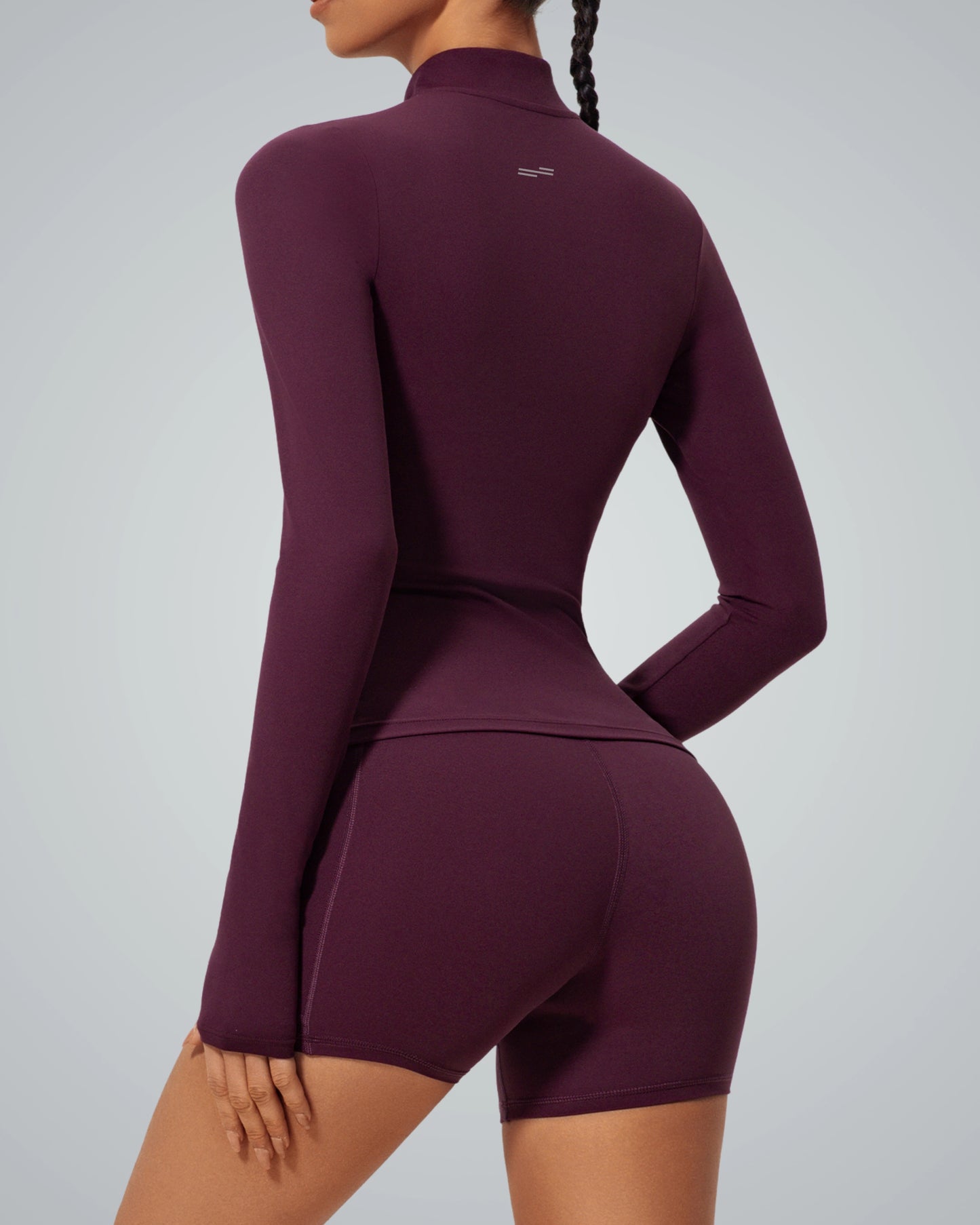 Bandsam FluidForce seamless gym set in bold colorblock, featuring a sleek high-neck zip-up and shorts for a street-style fitness look.