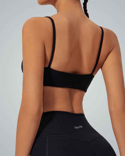 Back view of woman wearing Bandsam GlowLift Bra, highlighting its stretch, comfort, and support ideal for yoga, pilates, and lounging.