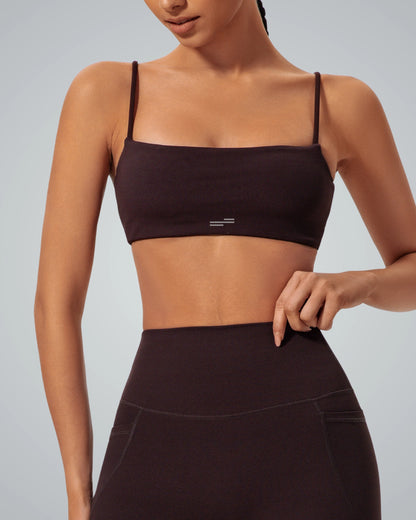 Bandsam GlowLift Bra in dark color, offering flexible support for women's comfort in yoga, pilates, and outings. Ideal for modern activewear.