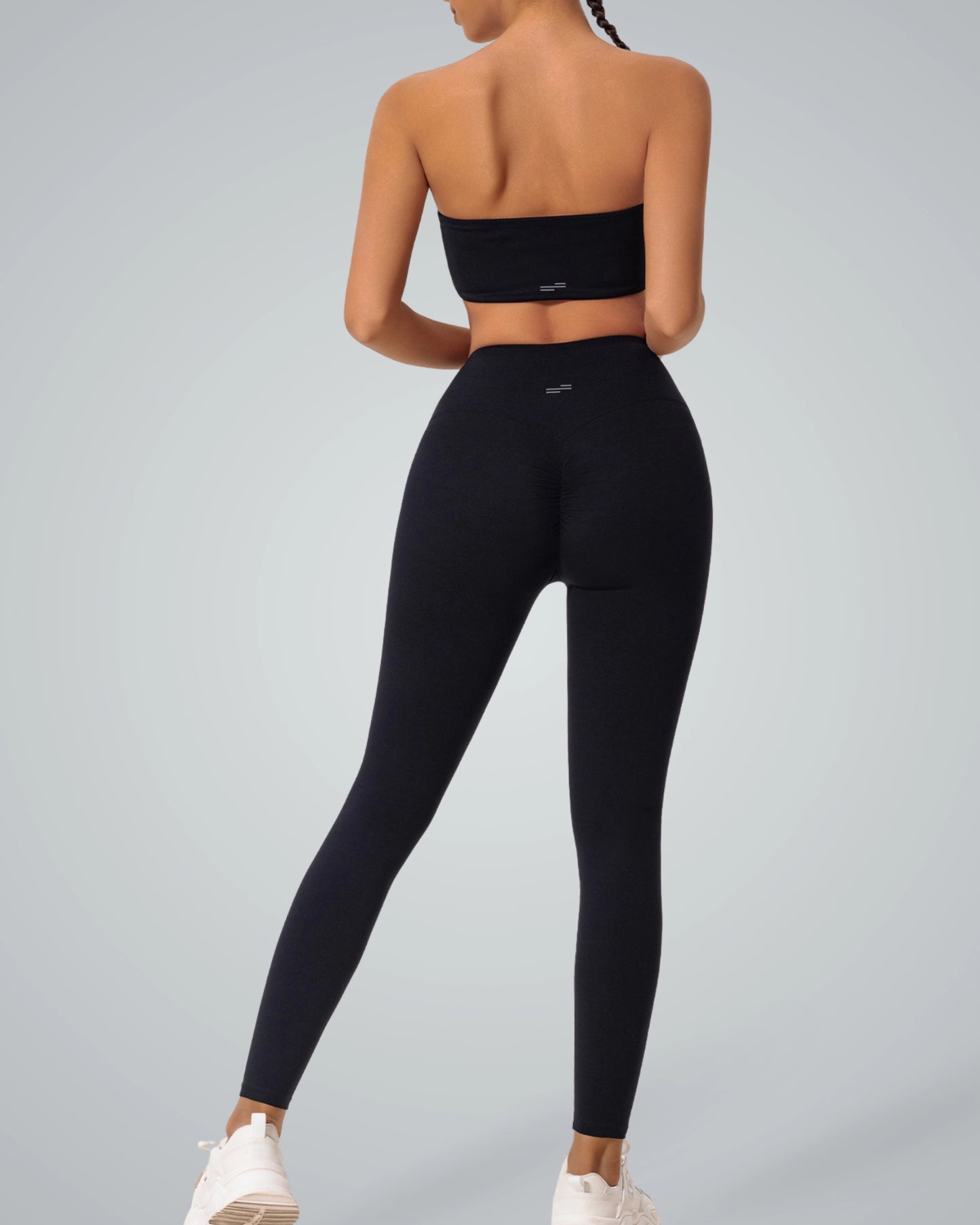 Bandsam LuxePulse Active Set in black, featuring a bandeau top and high-waisted leggings. Perfect seamless gym set or trendy workout co-ord.