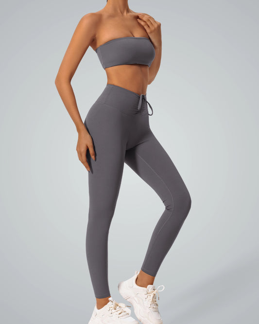 Bandam LuxePulse Active Set with sports bra and high-waisted leggings, seamless two-piece for yoga, sleek gray athleisure outfit.
