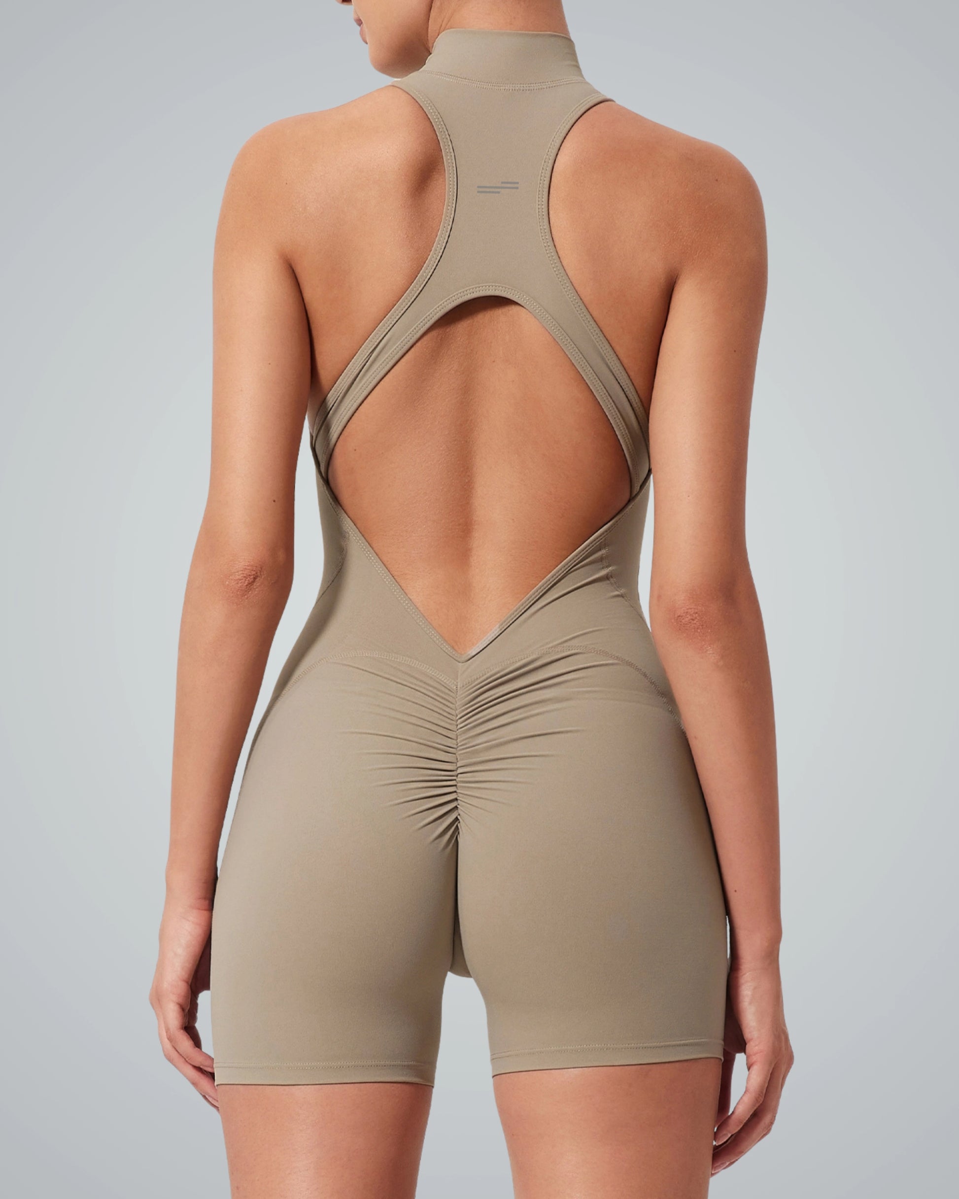 Back view of Bandsam Midnight Motion Bodysuit, women's activewear for yoga and pilates, featuring flexible stretch fabric and open back design.