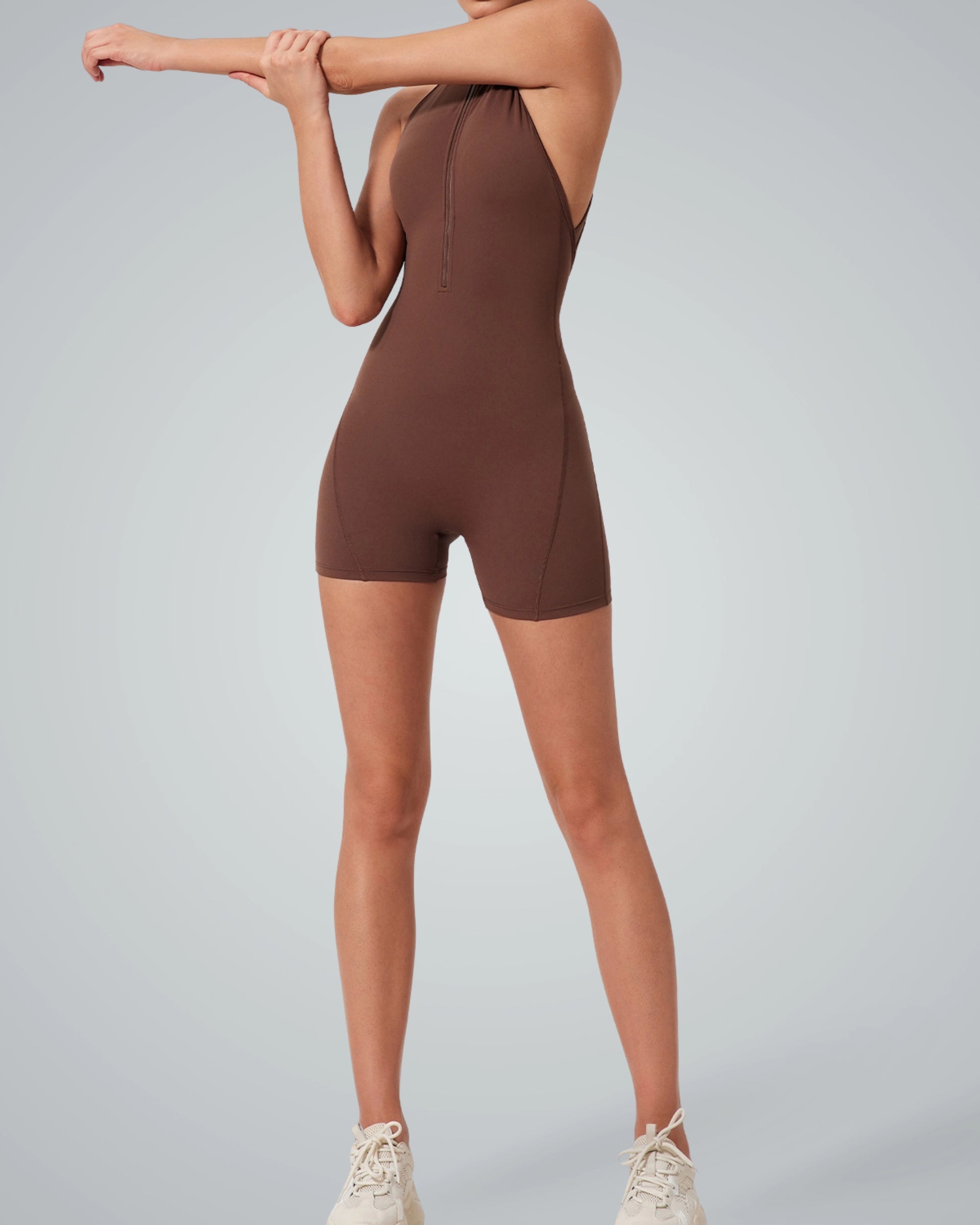 Woman wearing Bandsam Midnight Motion Bodysuit, showcasing stretchy and comfortable sleeveless design for activewear or lounging.