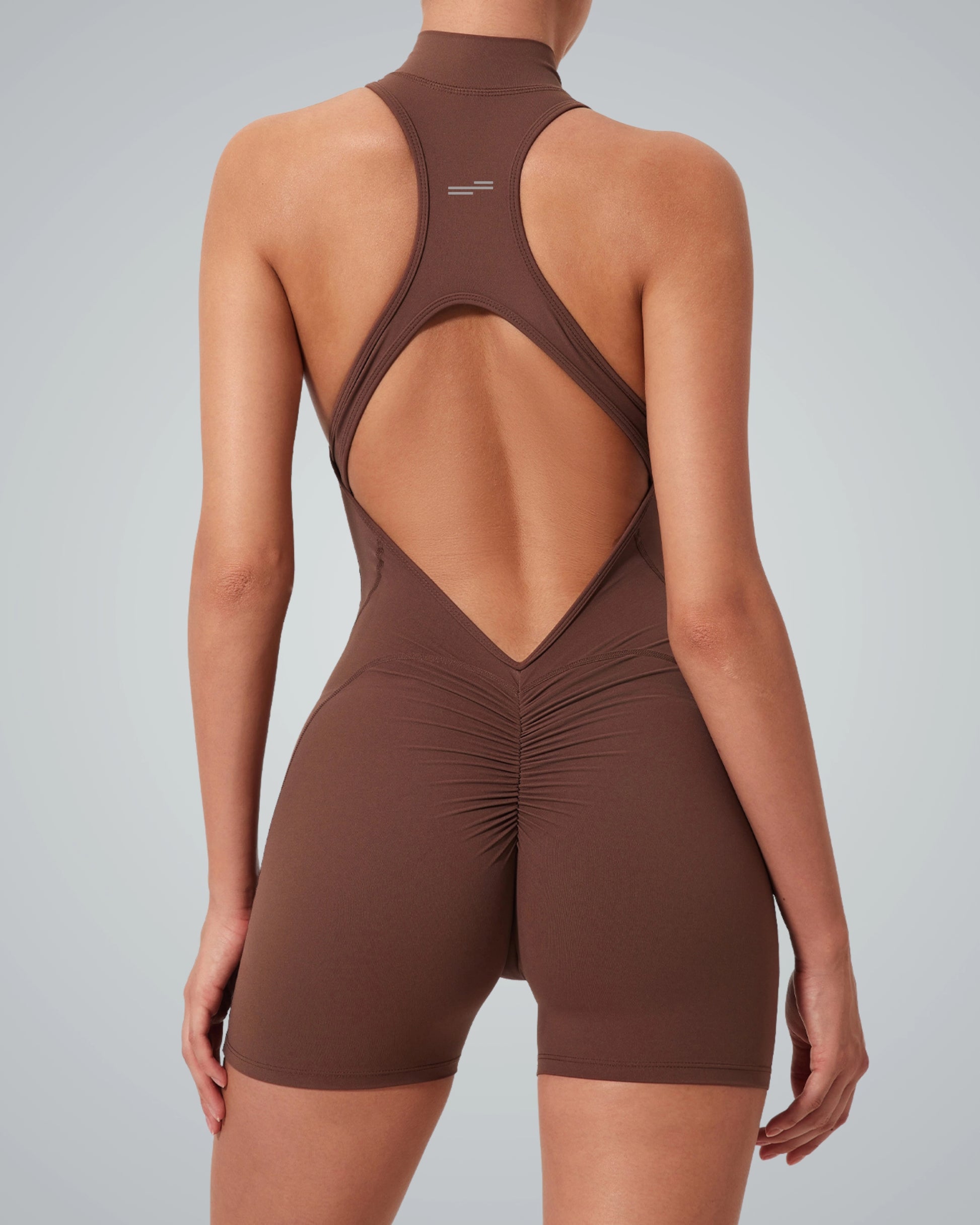 Rear view of woman wearing Bandsam Midnight Motion Bodysuit, showcasing stretch, comfort, support, and flexible design for active women.