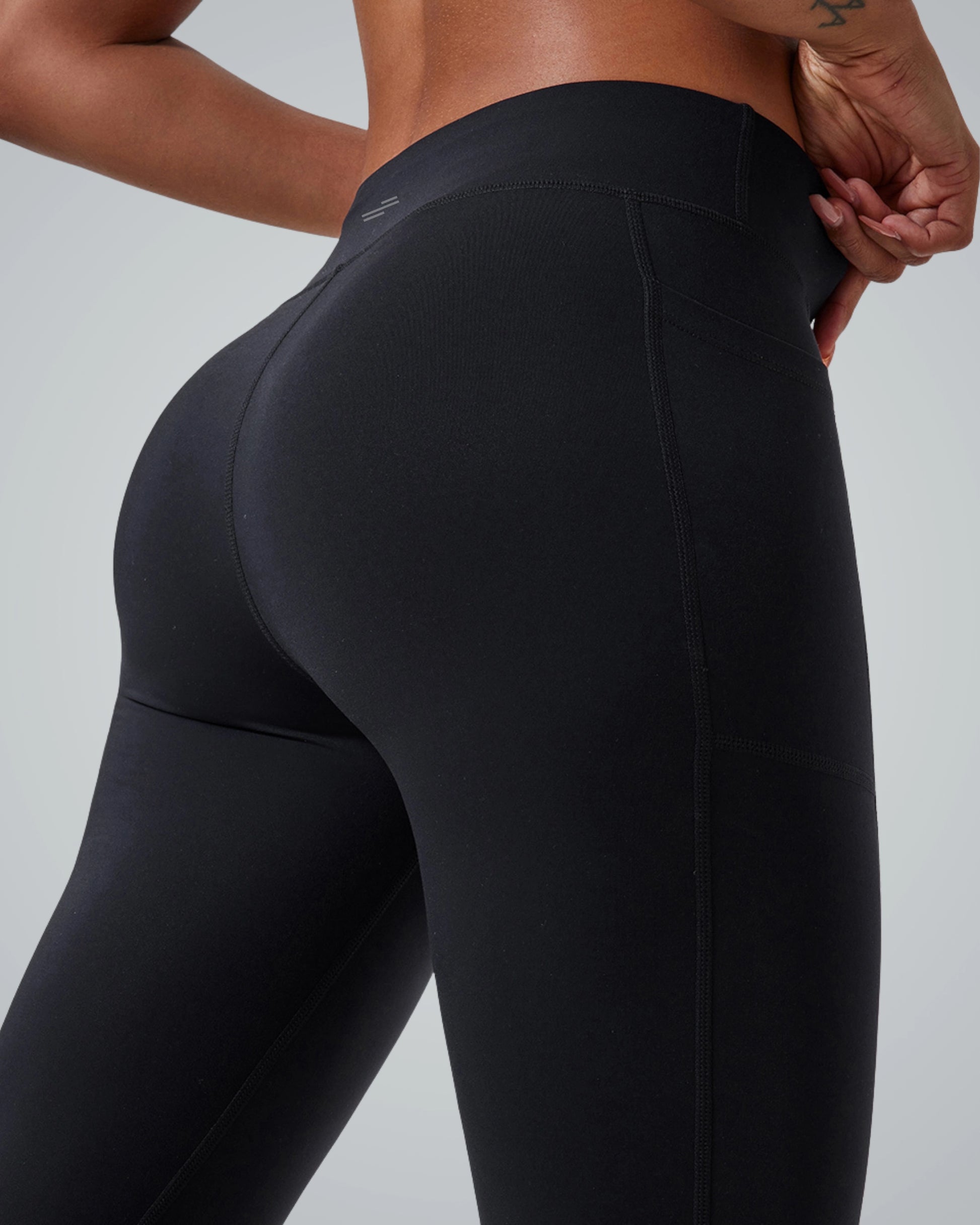 Bandsam PeakFit Pocket Leggings in black, showcasing high-waisted design and side pocket. Perfect for yoga, workouts, and casual outings.