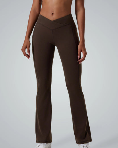 Woman wearing brown high-waisted Bandsam PeakFit Pocket Leggings, perfect for stretch, comfort, and support during yoga or workout.