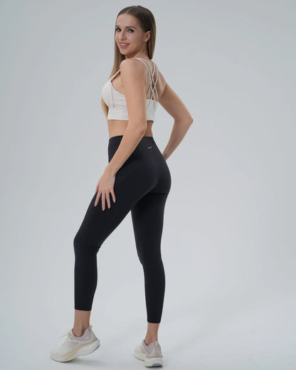 Woman in Bandsam PrimFit Set wearing a seamless sports bra and high-waisted leggings, showcasing a trendy minimalist gym set.