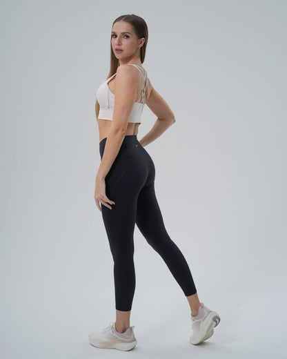 Woman wearing Bandsam PrimFit seamless sports bra and high-waisted leggings, showcasing a trendy gym co-ord and minimalistic athleisure style.