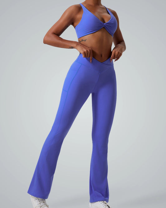 Model wearing Bandsam SculptEase Set: twist-front sports bra and high-waisted flared trousers, perfect seamless gym set and athleisure co-ord.