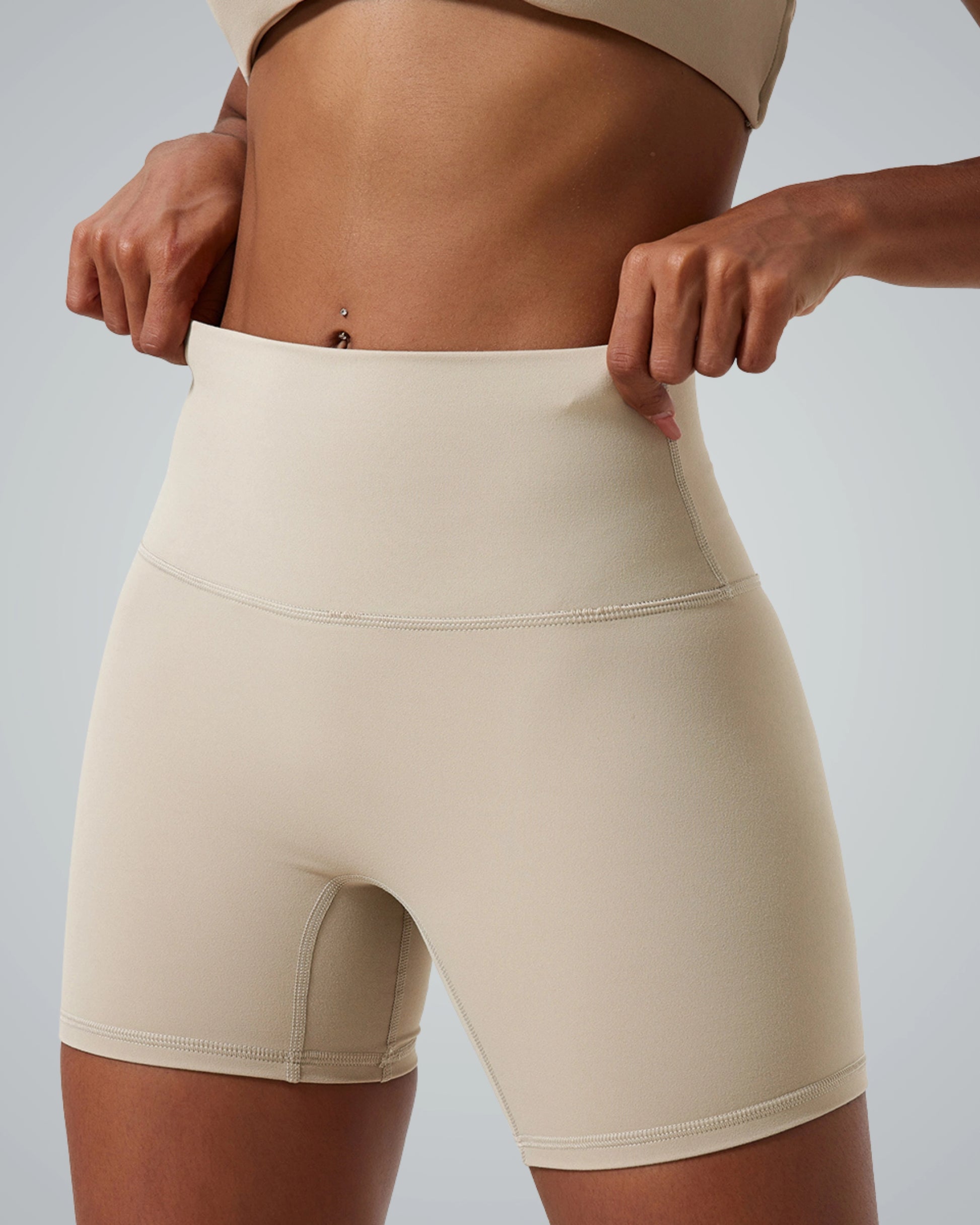 Bandsam SereneFit Shorts for women, beige high-waisted activewear designed for stretch, comfort, and flexibility in workouts and yoga.