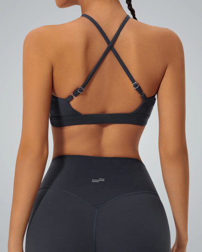 Back view of woman wearing Bandsam ShapeSync Bra with crisscross design, perfect for comfort, yoga, workout, and flexible activewear.