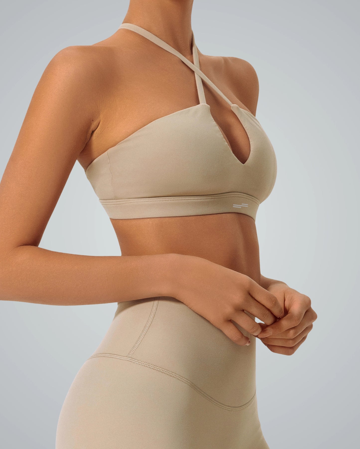 Woman wearing Bandsam ShapeSync Bra, featuring crisscross design, for comfort and support in yoga, pilates, and activewear.