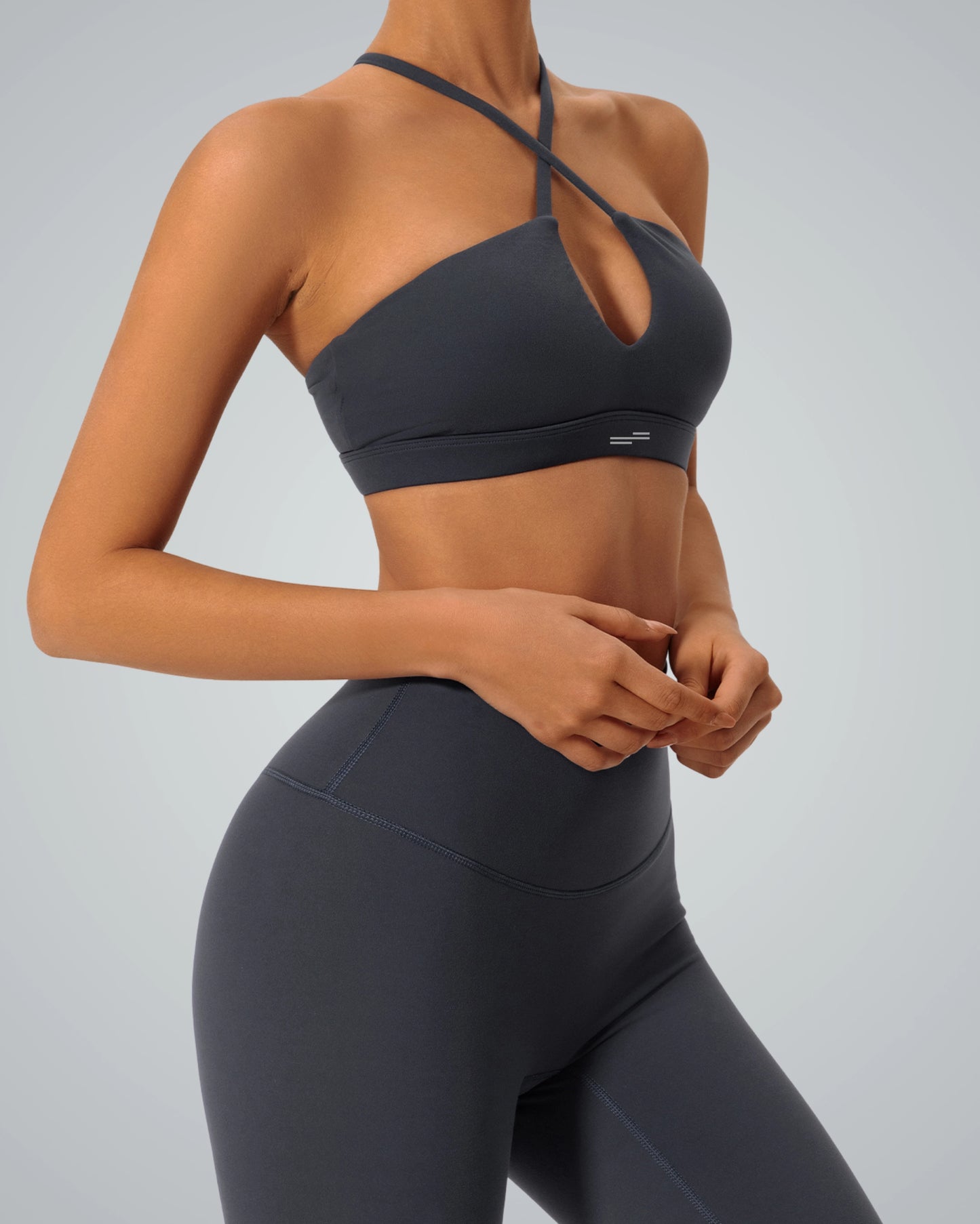Woman wearing Bandsam ShapeSync Bra, showcasing crisscross design and comfort for activewear, yoga, pilates, and lounging.