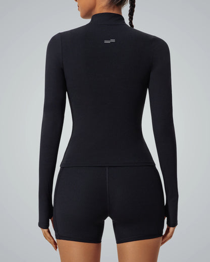 Rear view of woman wearing Bandsam SmoothFit Long Sleeve activewear; black, stretchy fabric perfect for yoga and workouts.