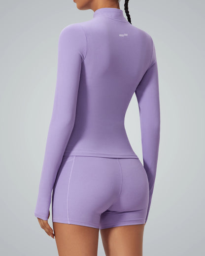 Woman in purple Bandsam SmoothFit Long Sleeve, showcasing stretch and flexibility. Ideal for activewear, yoga, pilates, or lounging.