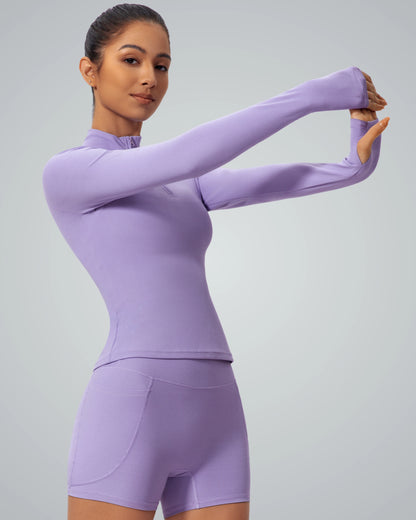 Woman wearing Bandsam SmoothFit Long Sleeve in lilac, ideal for yoga and workouts, offers style, stretch, and comfort.