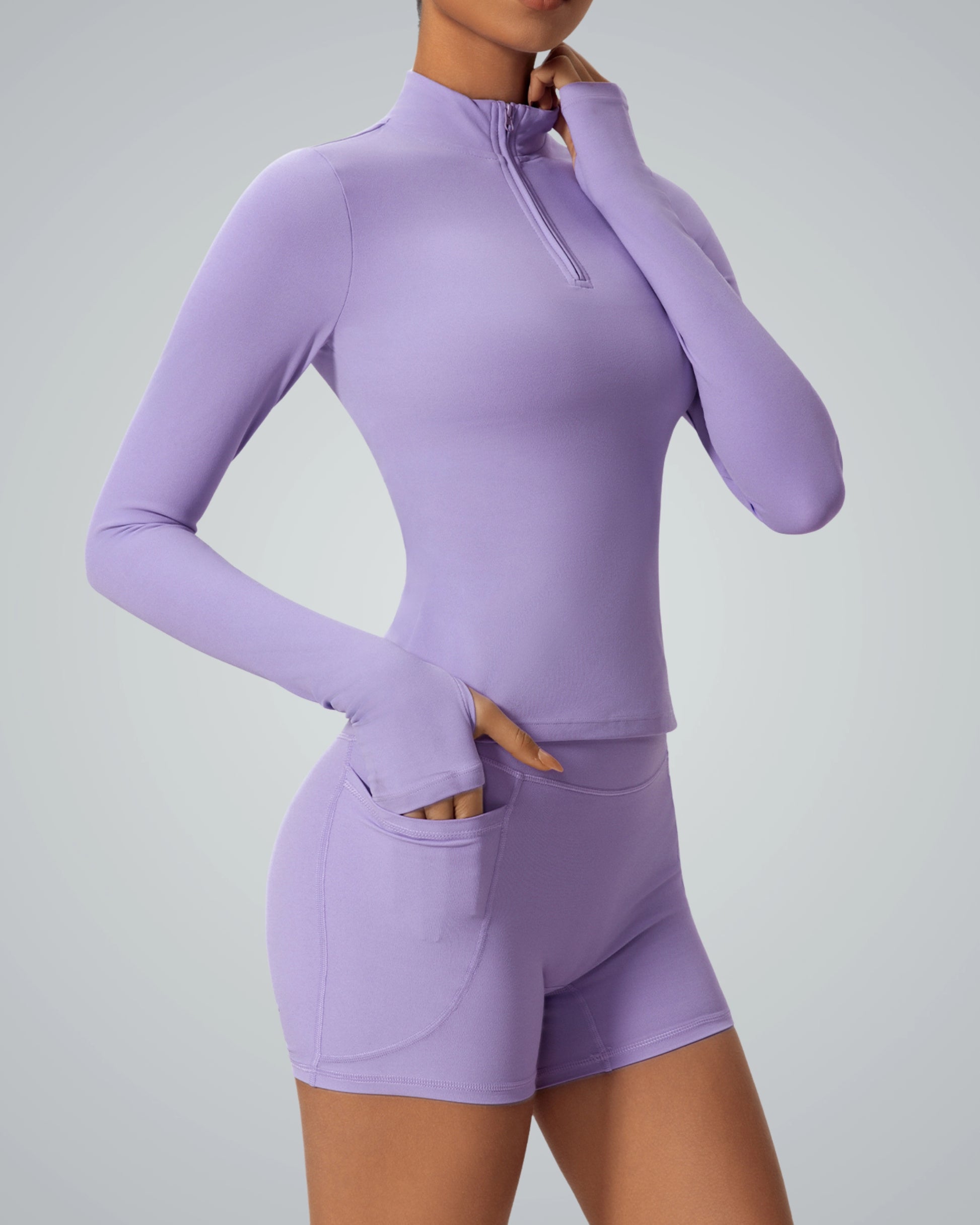 Woman wearing Bandsam SmoothFit Long Sleeve in lavender; perfect for yoga, pilates, and lounging with comfort, flexibility, and style.
