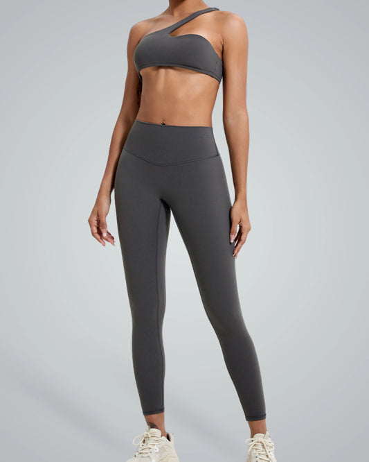 Bandsam ToneTwin Set: Seamless gym set featuring asymmetrical top and high-waisted leggings. Stylish compression activewear for women.