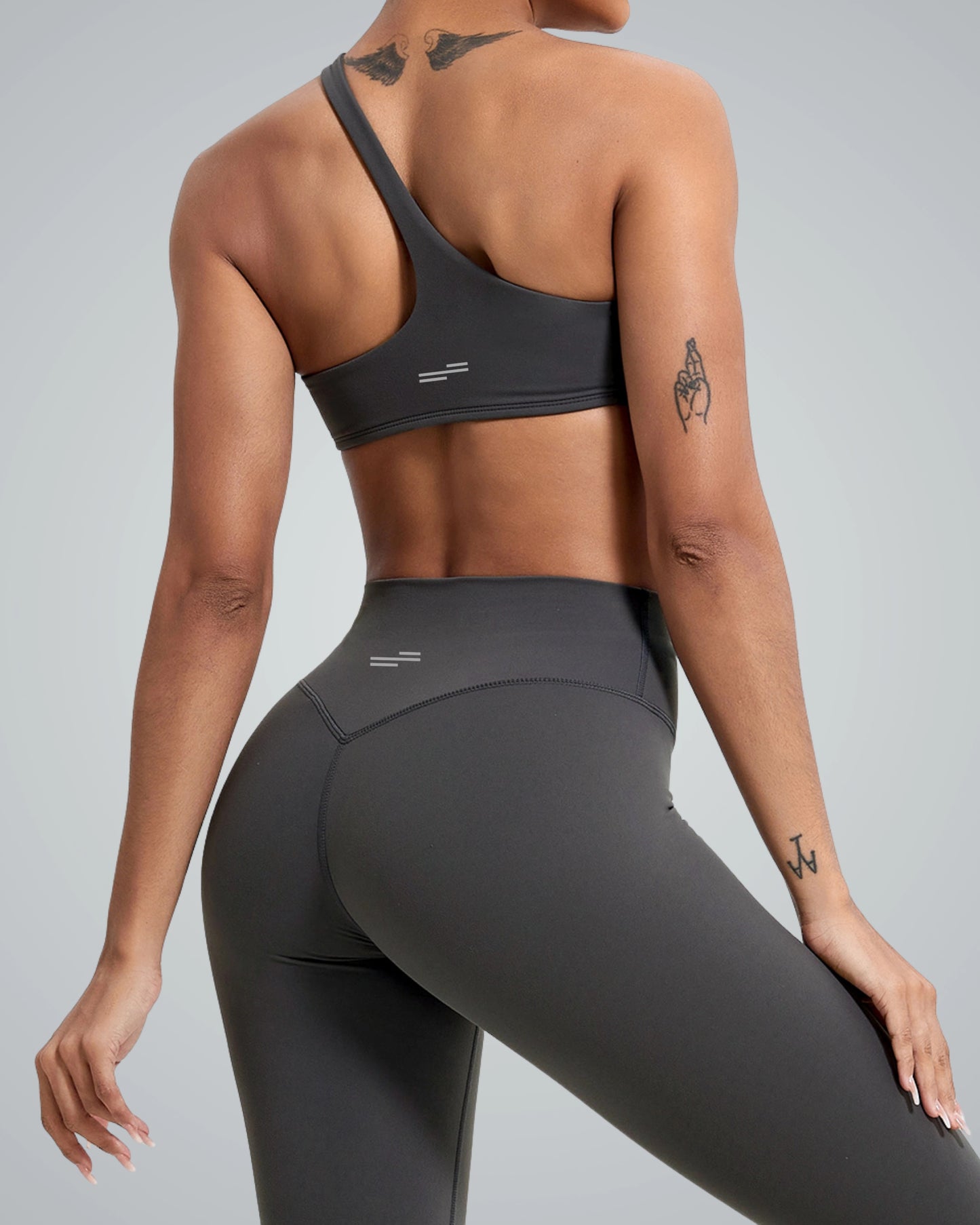 Bandsam ToneTwin Set with asymmetrical sports bra and high-waisted leggings, a seamless two-piece activewear for yoga and gym.