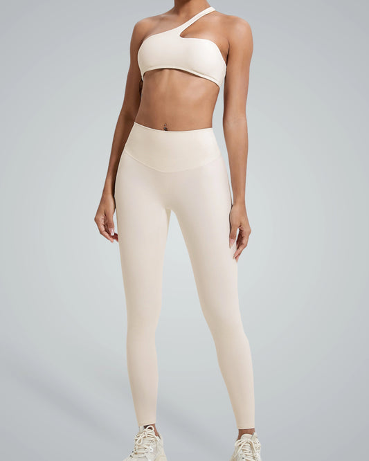 Bandsam ToneTwin Set seamless gym set with asymmetrical top and high-waisted leggings for a trendy, sweatproof workout outfit.