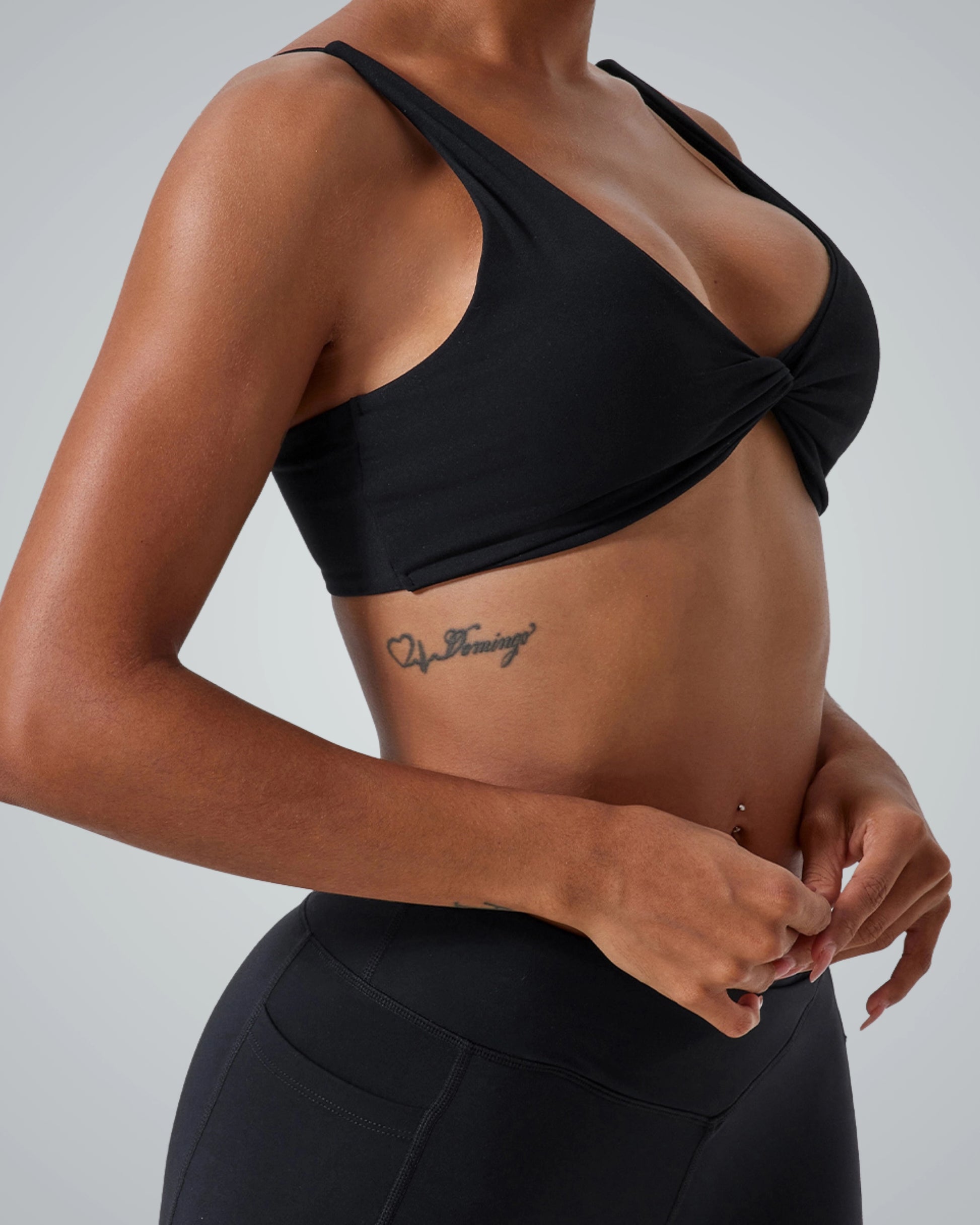 Woman wearing Bandsam TwistFit Bra, ideal for yoga and workouts. Soft, stretch activewear for modern women.