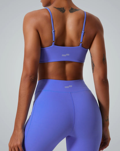 Back view of woman in Bandsam TwistFit bra and leggings, highlighting stretch and support for activewear, yoga, and workout.