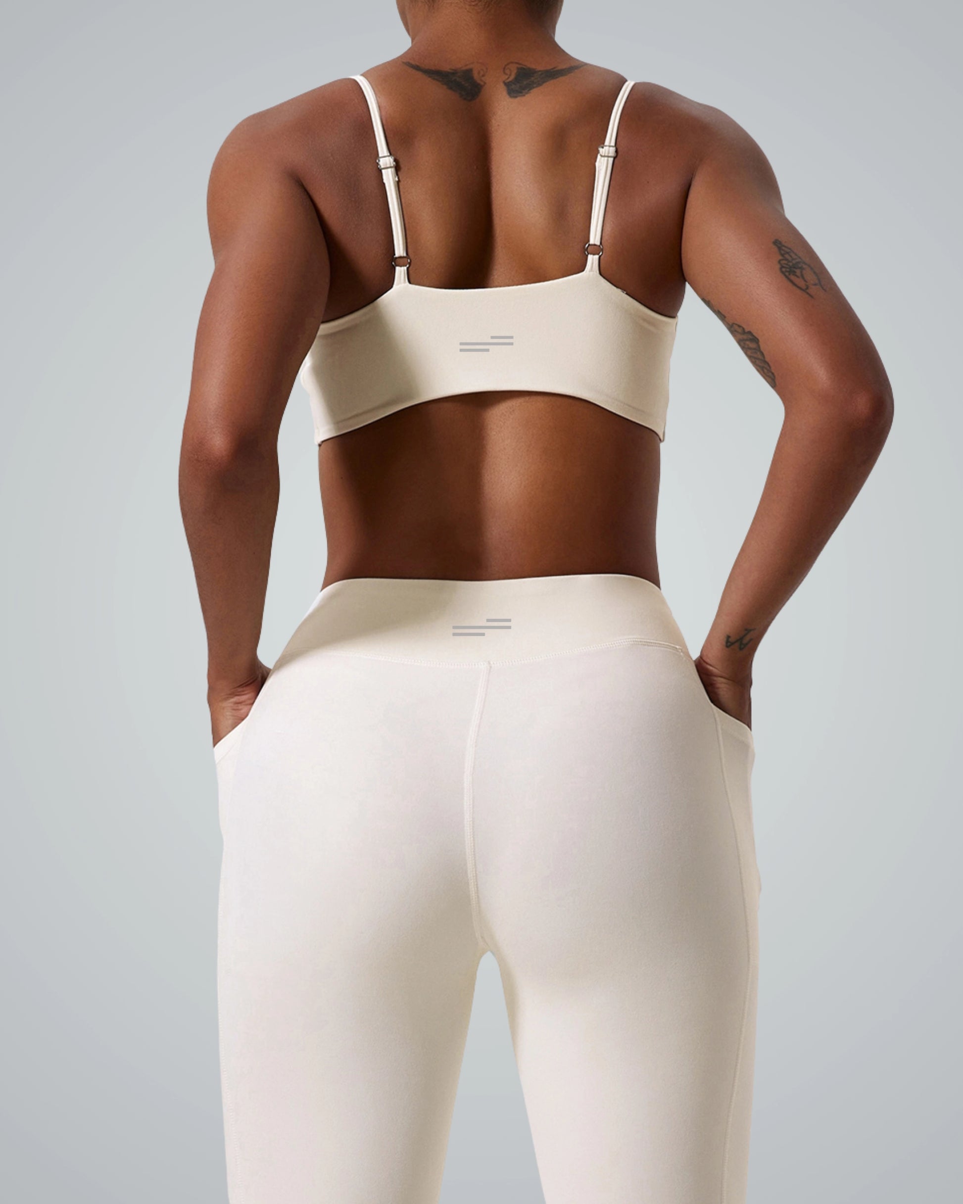 Back view of woman wearing Bandsam TwistFit Bra in soft activewear, ideal for yoga and workout, offering stretch and support.