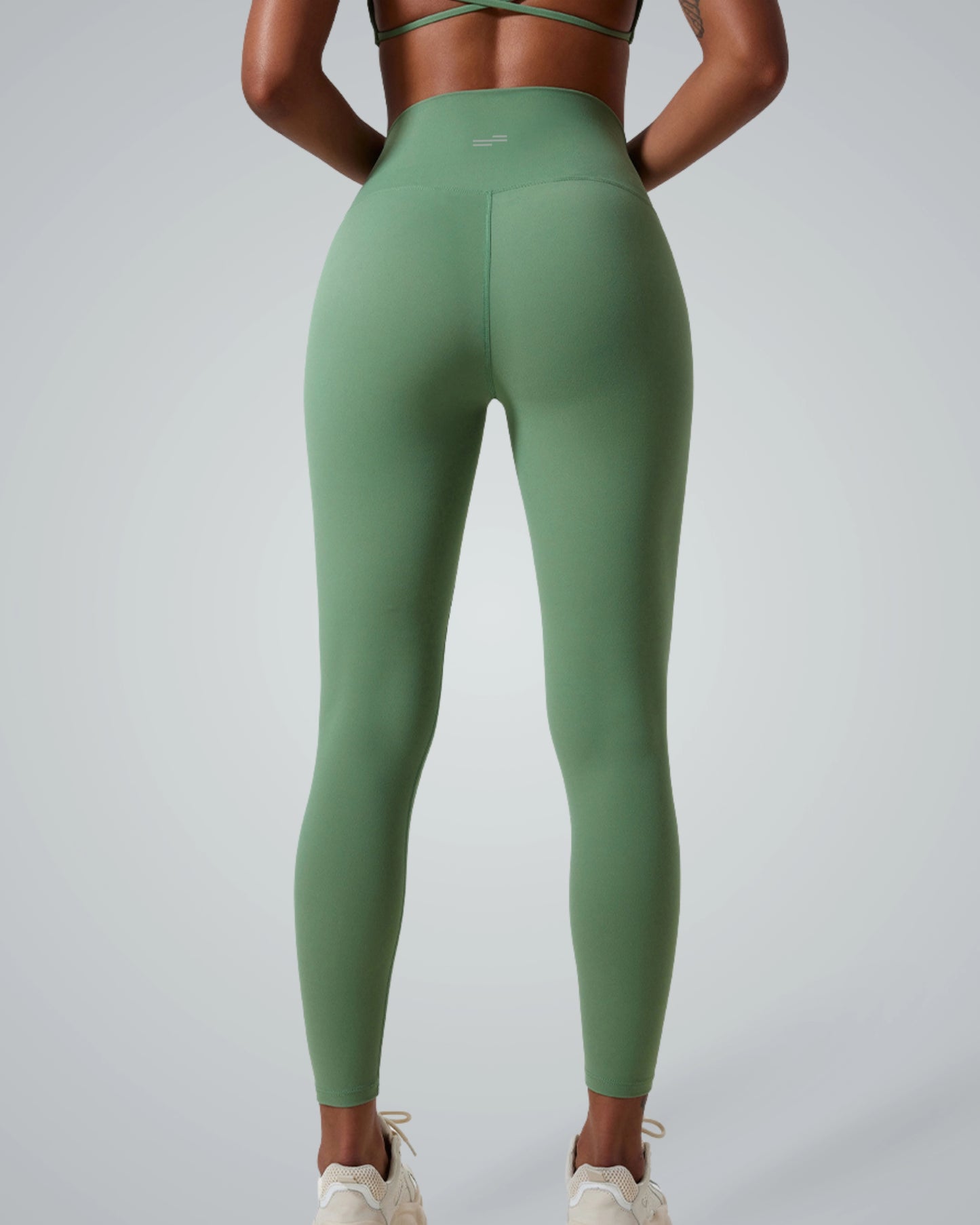 Back view of woman wearing green Bandsam UltraSkin Fit Leggings, showcasing high-waist design and soft, flexible activewear fit.