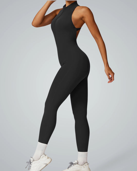 Woman modeling the Bandsam VelocityVibe Jumpsuit in black, ideal for stretch yoga, activewear, comfort, and flexible workouts.
